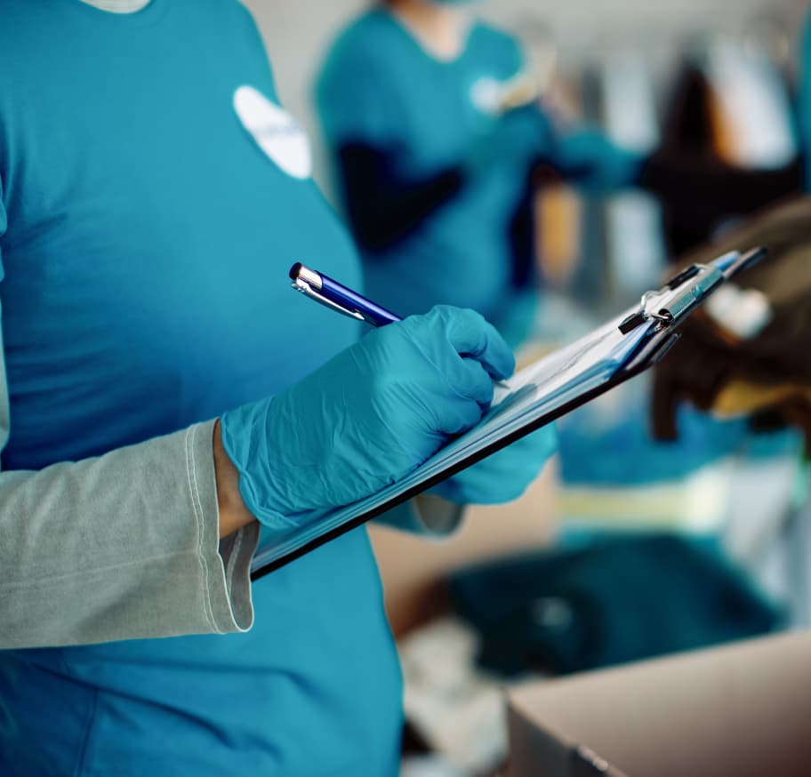 closeup going through medical supply checklist